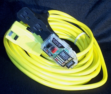 An GFCI outlet tester with Power Quality Monitor plugged into a 15 amp Tri-tap with a 50 ft cord and GFCI Plug.
